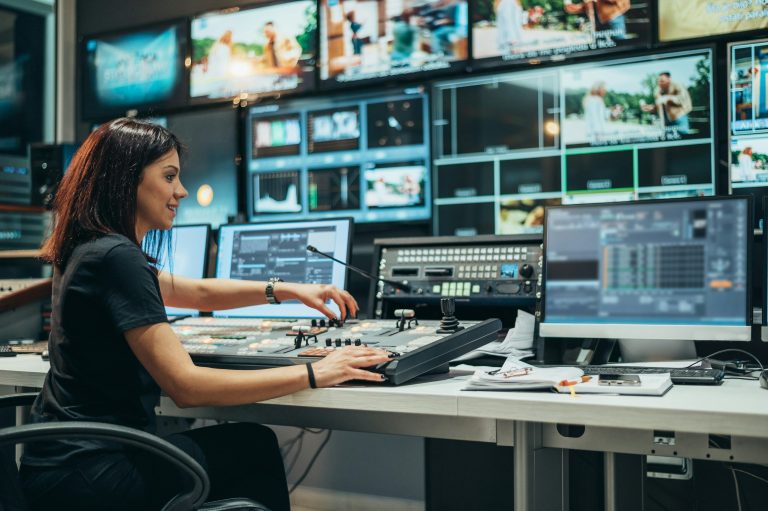 Operator monitoring SCADA control room screens for system conversions